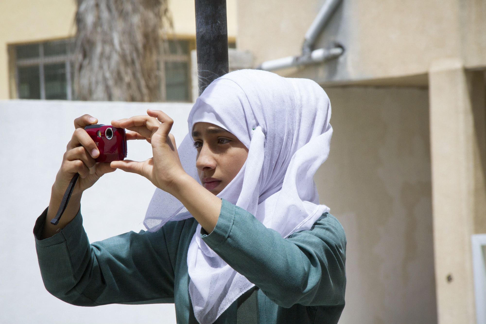 The Syrian 7th grader Maryam takes pictures of her daily routine. Each of the students take the task very seriously.